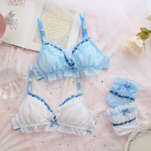 A white and light blue fairy-inspired lingerie set with intricate floral embroidery and ruffles.